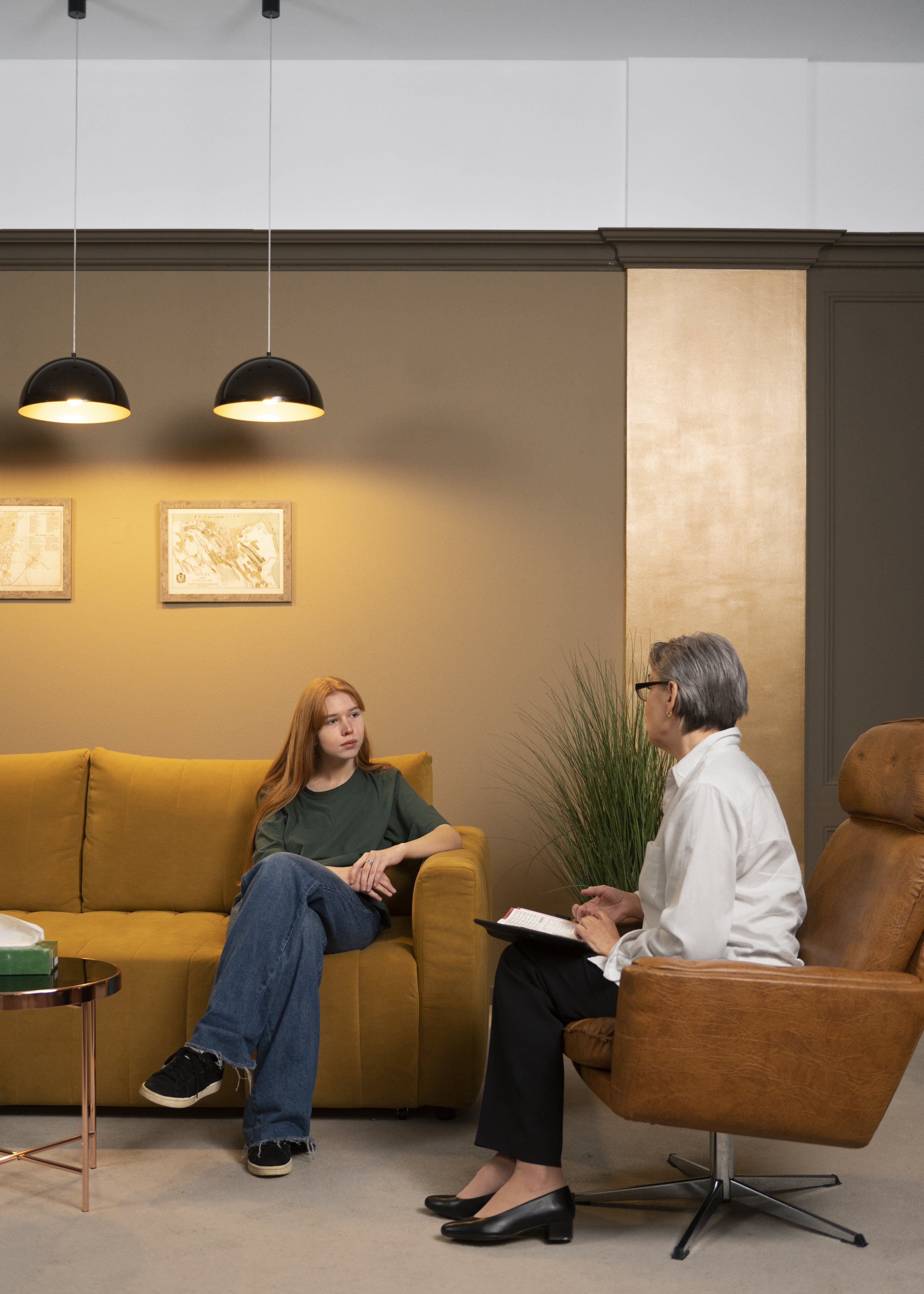 Person feeling emotionally overwhelmed while discussing about trauma recovery and EMDR therapy.