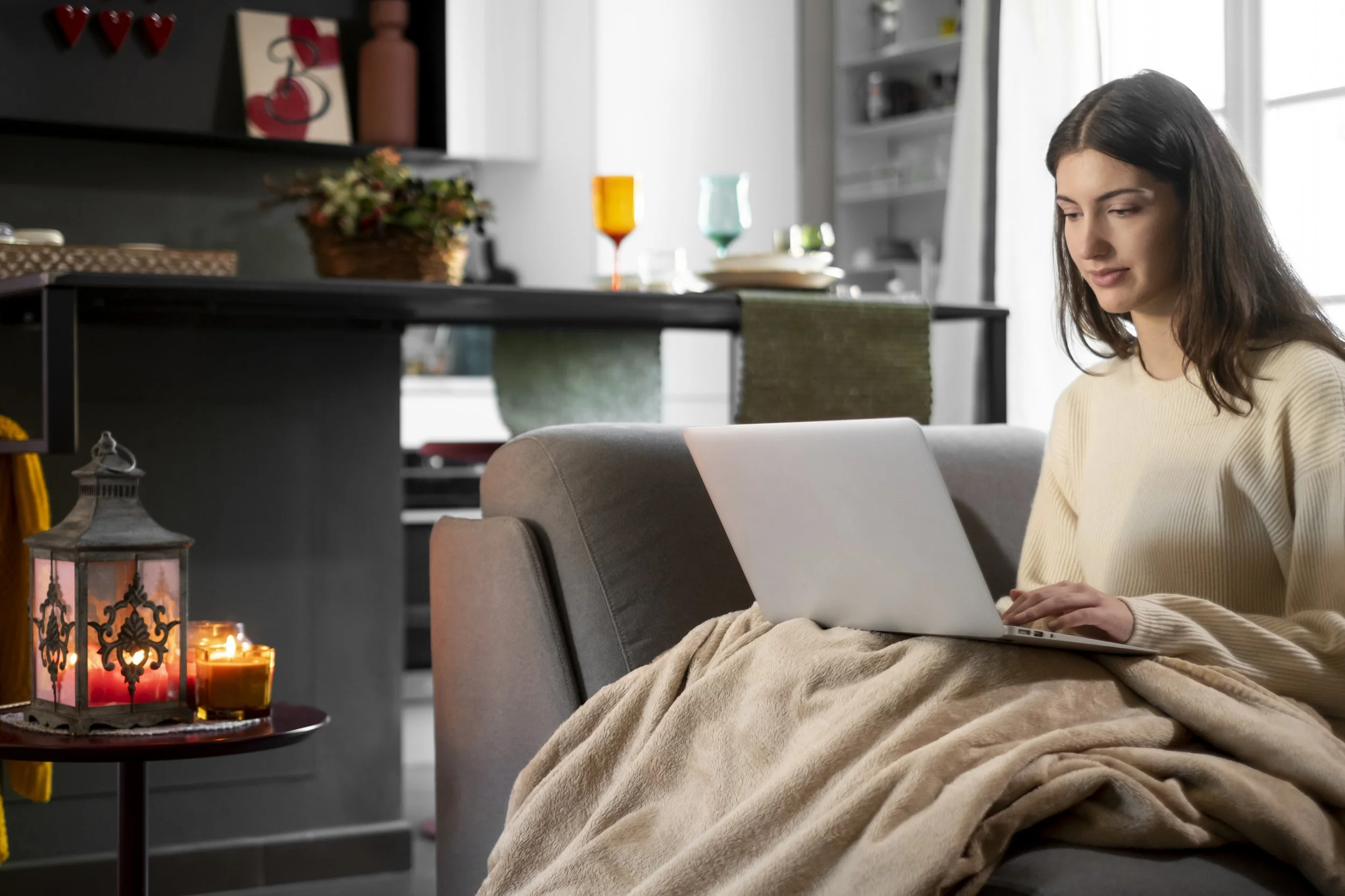 Calm home workspace with coffee, notebook, and laptop used to prepare for an online counseling consult
