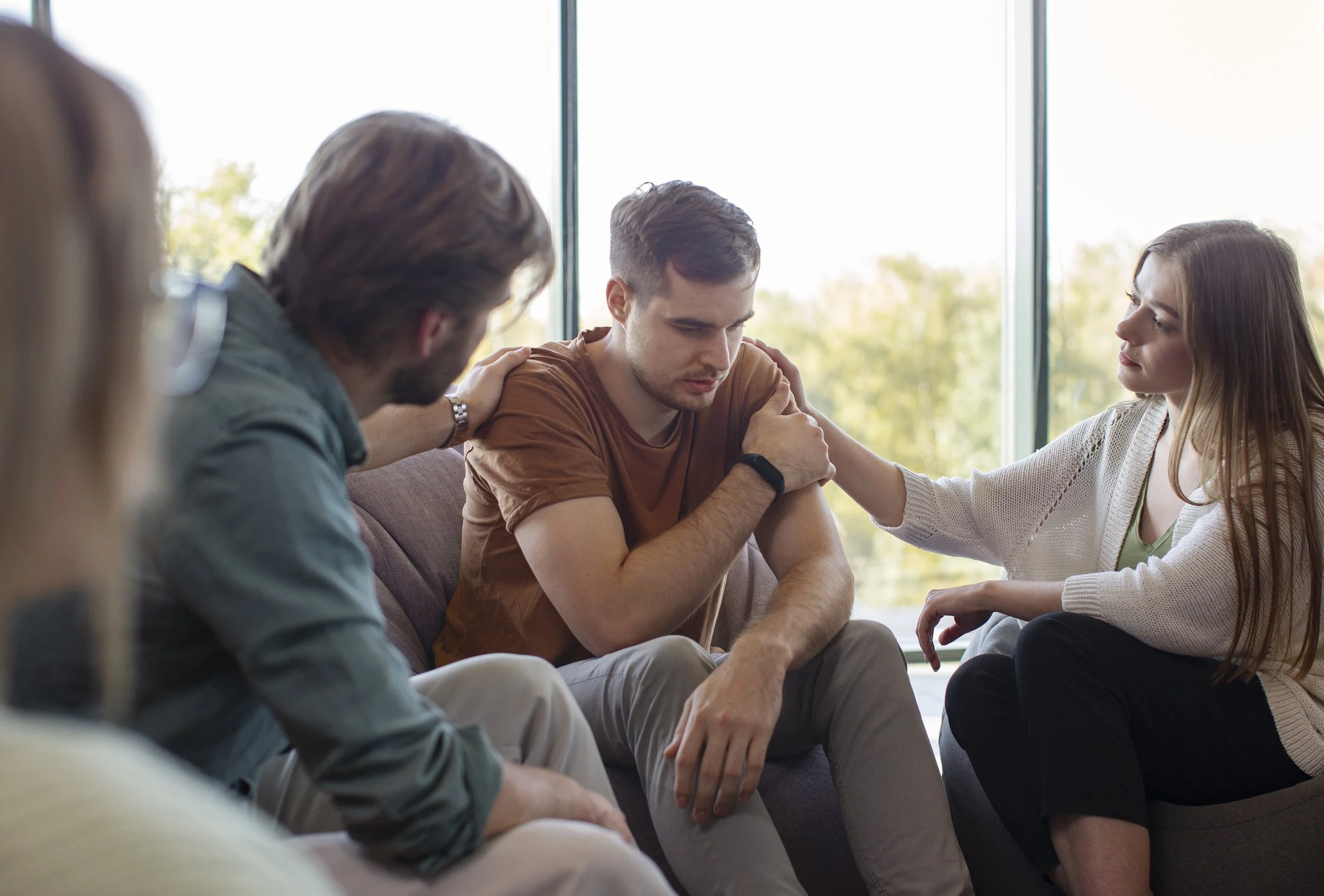 Person building emotional resilience and support systems through counseling.