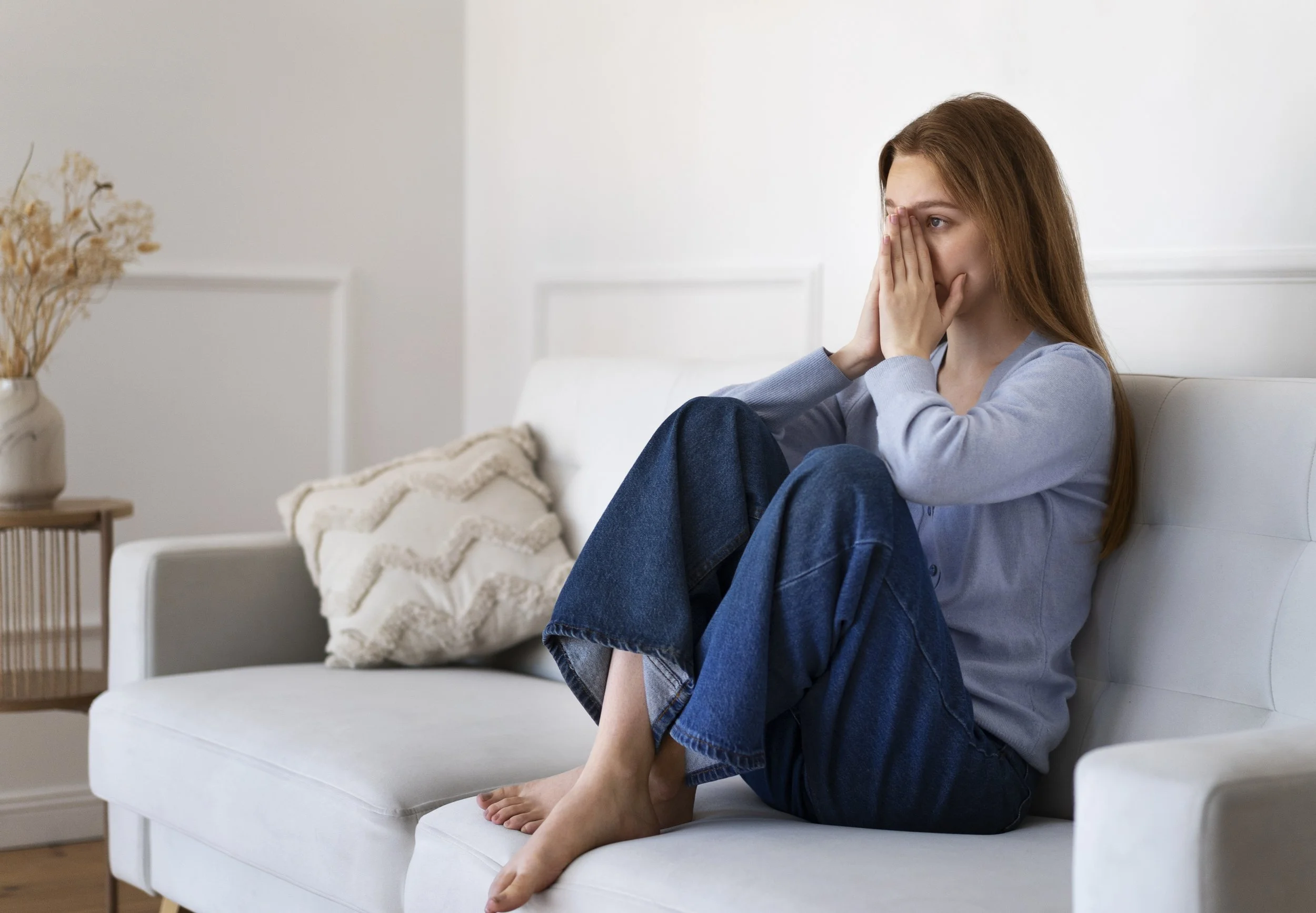 Person experiencing mild stress while managing daily responsibilities.