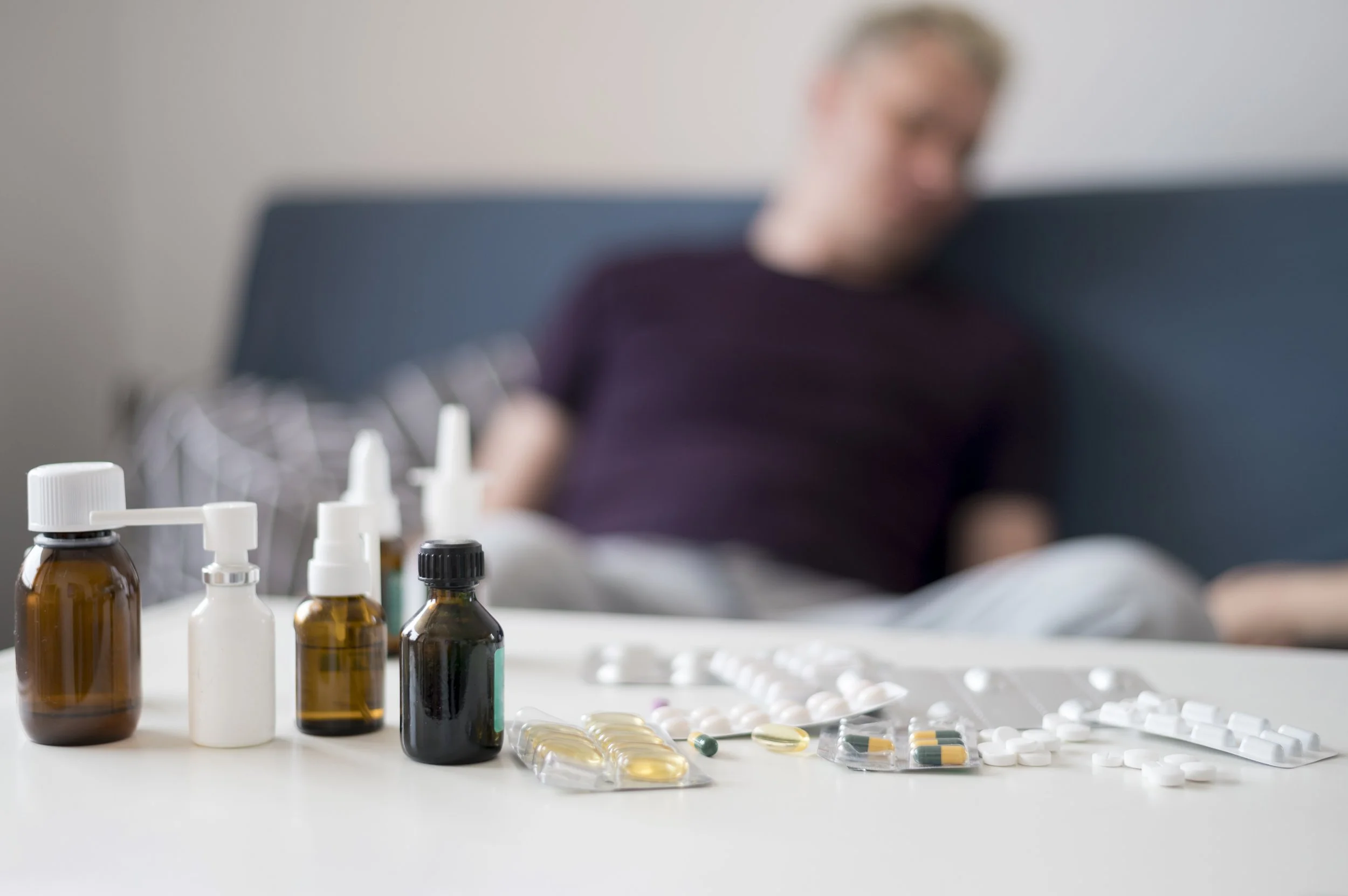 Person feeling overwhelmed and using substances as a way to cope with stress.