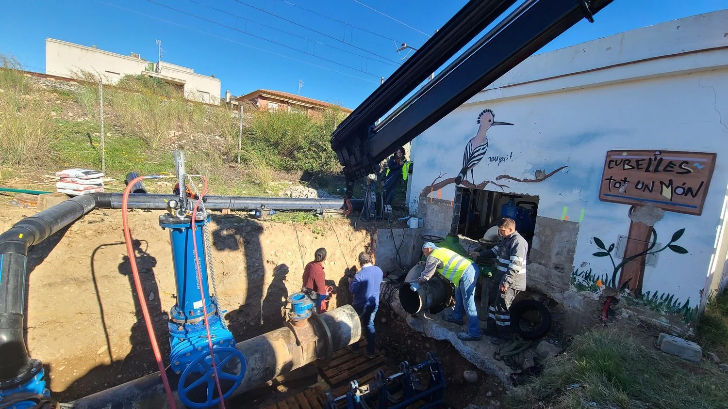 Municipal sewer pipeline intervention with installed valve and piping assembly, showing controlled excavation, tie-in work, and infrastructure upgrade activities.