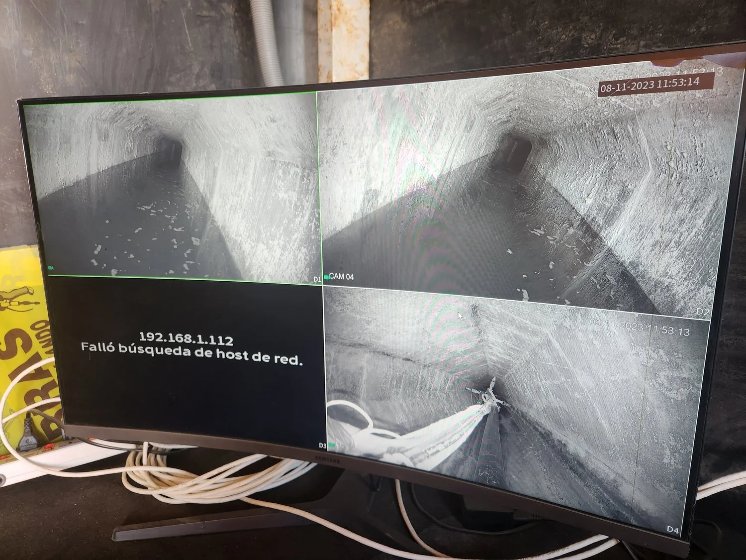 Pipeline CCTV inspection footage displayed on a monitoring screen, showing internal pipe condition assessment for municipal or industrial infrastructure.