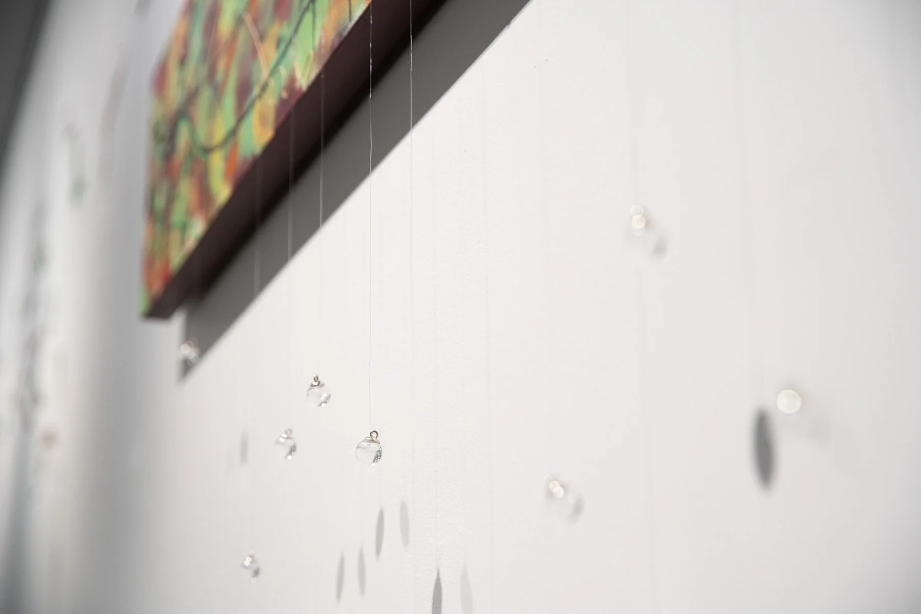Marran (veins)
Mandy Nicholson (Wurundjeri) 2025
Painted and sewn/woven/stitched elements
The work embodies the intertwining of veins within a gum leaf, within our bodies, within Country. Marran, meaning ‘veins’, is also the Woiwurrung name for leaf.
