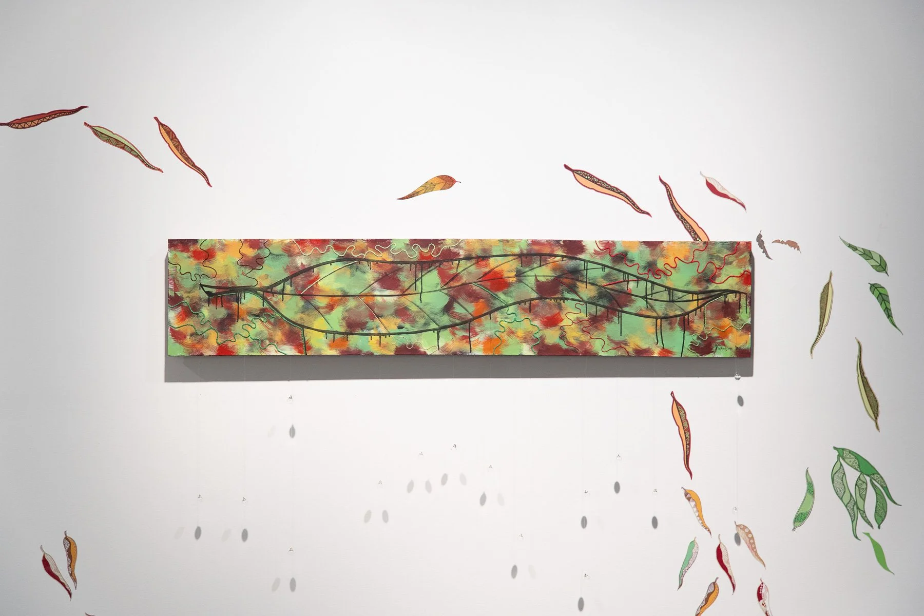 Marran (veins)
Mandy Nicholson (Wurundjeri) 2025
Painted and sewn/woven/stitched elements
The work embodies the intertwining of veins within a gum leaf, within our bodies, within Country. Marran, meaning ‘veins’, is also the Woiwurrung name for leaf.
