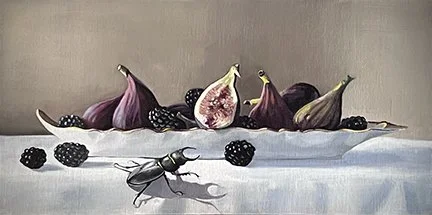 Arrangement of figs and blackberries on a white surface with a fly in the foreground.