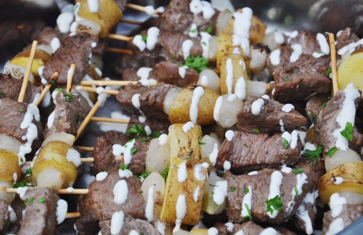 beef, potato and horseradish sauce on a skewer