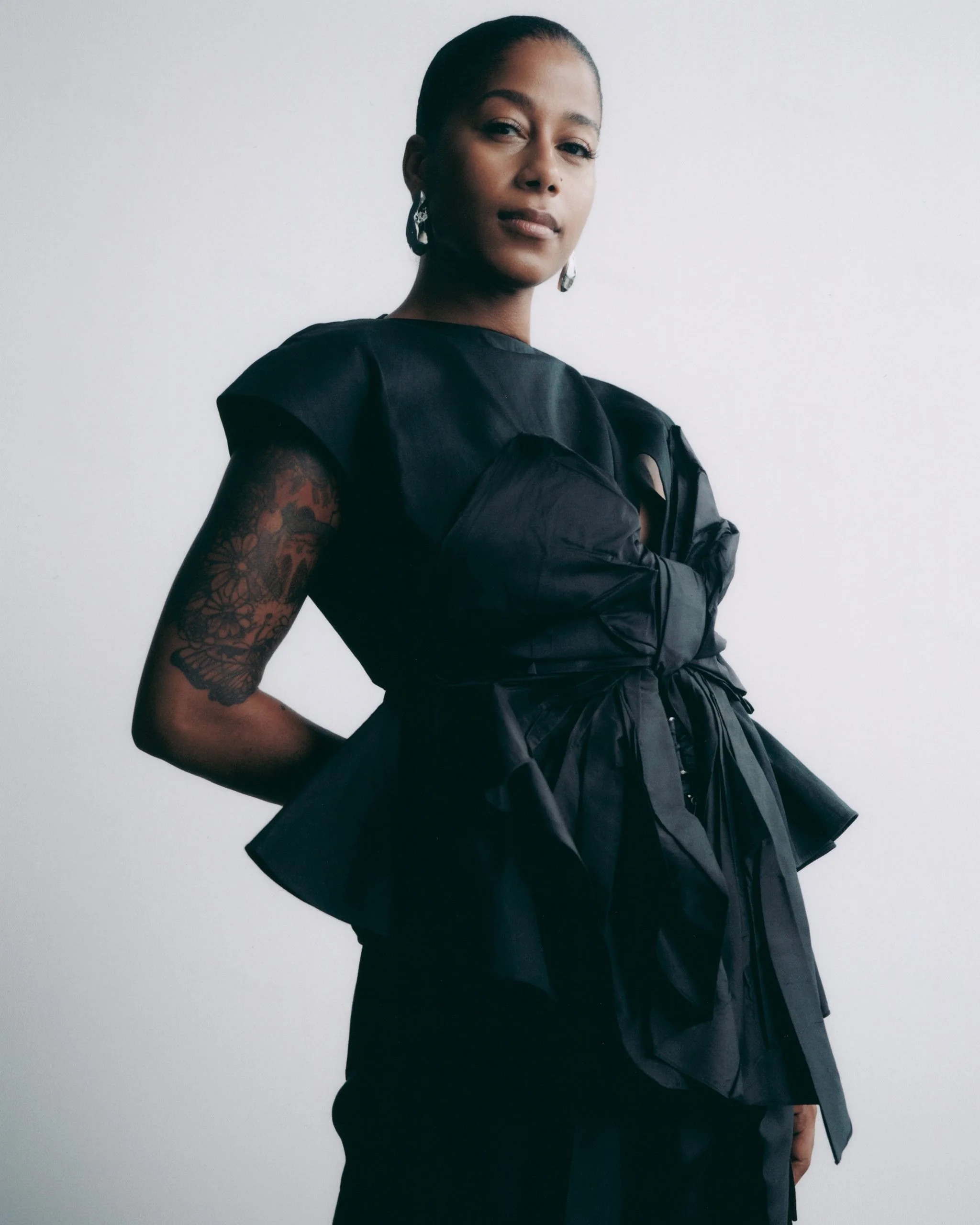aja-monet_standing-headshot-scaled.jpg