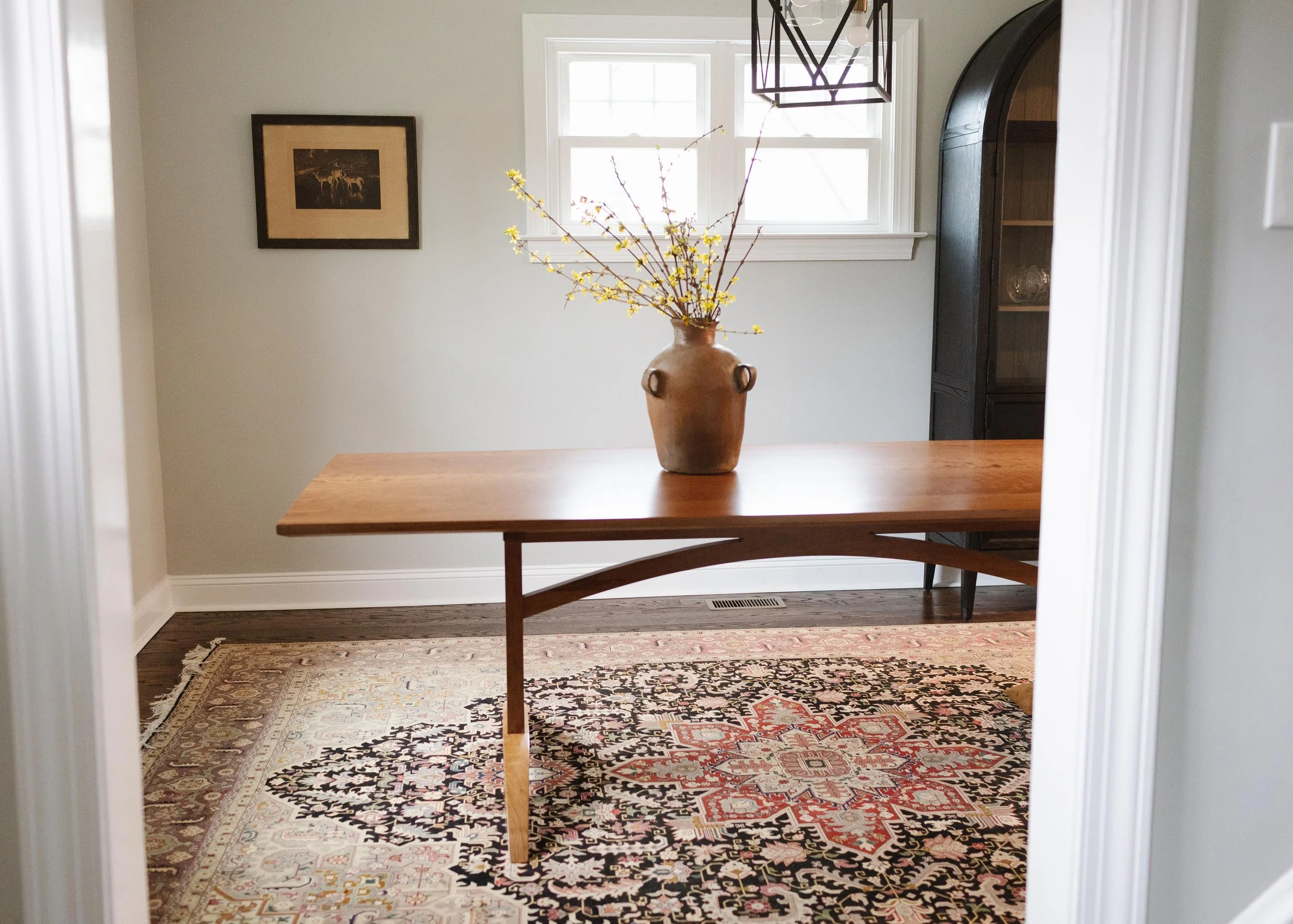 Solid Cherry Dining Table with through joinery and curved stretcher