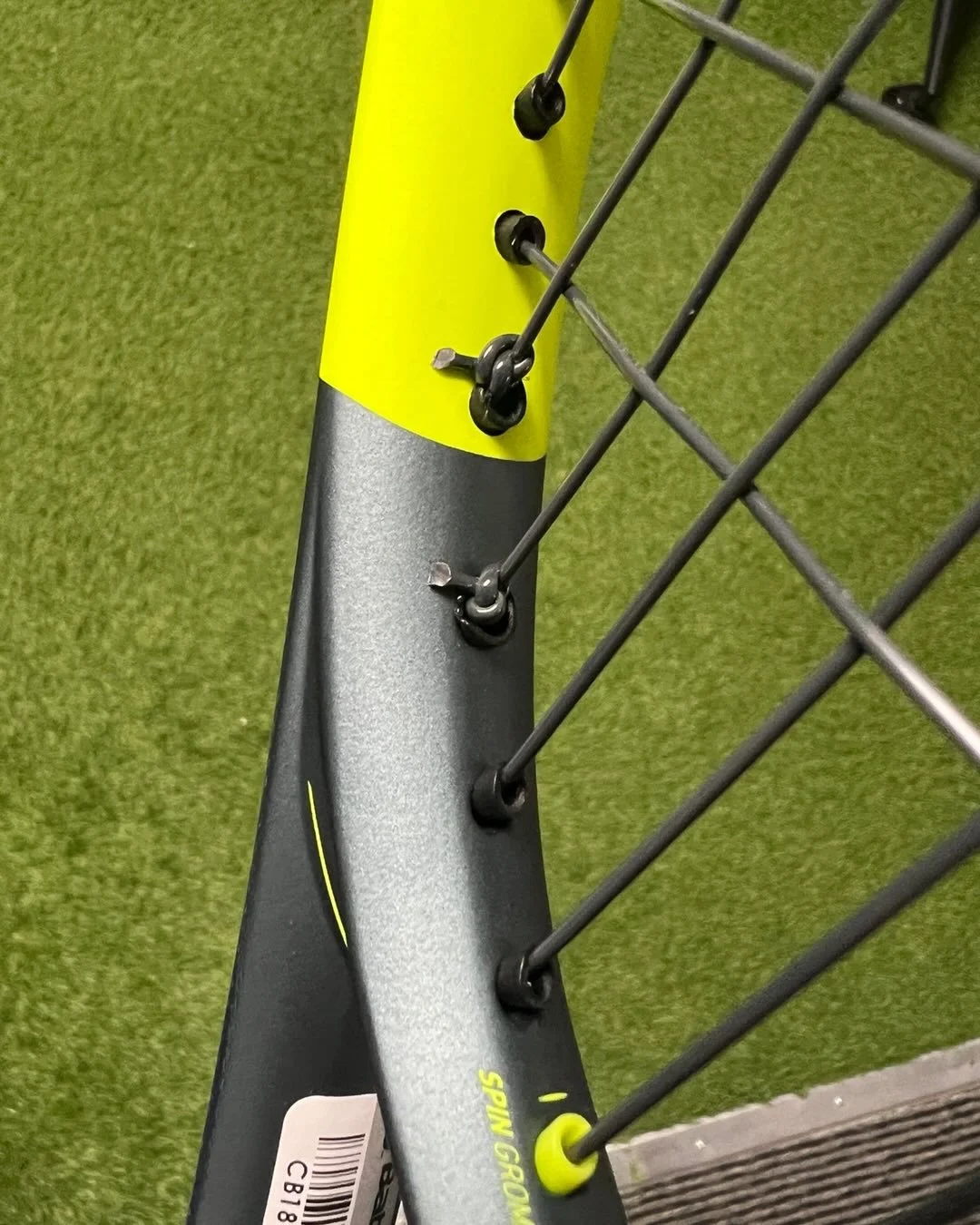 This is how a proper racquet stringing should look. Straight strings, tight knots, shorter knot tails, and strung top to bottom.