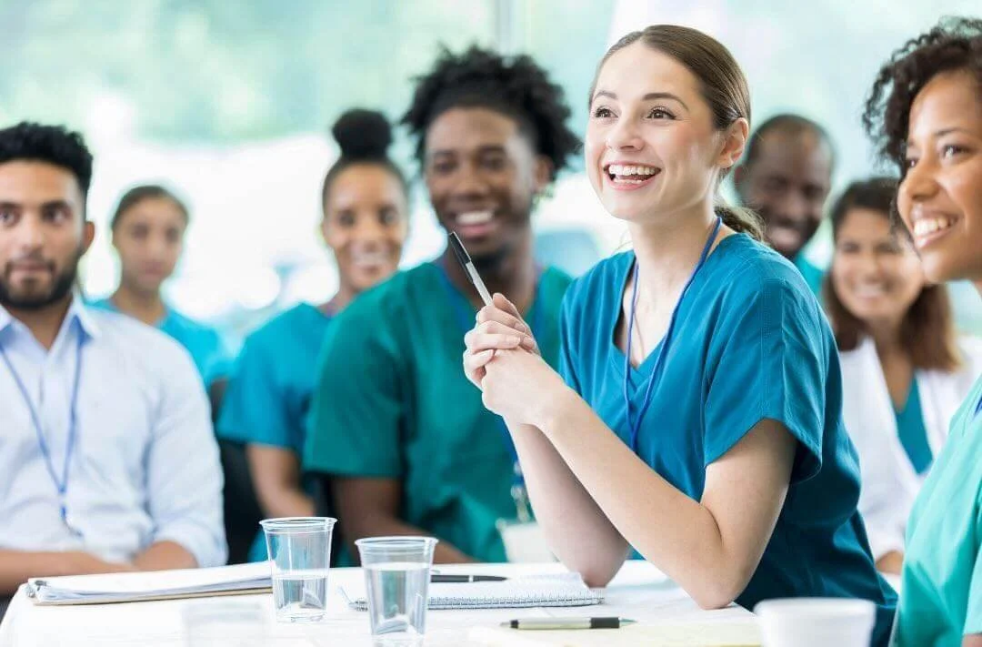 A group of nurses listening to the keynote speech.
