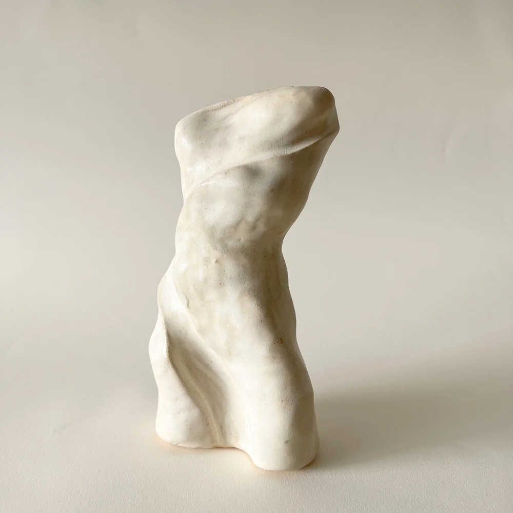 Elaine Truong. Circe (goddess of magic). Ceramic stoneware with stained yellow and white glaze. 2”L x 4”W x 8”H