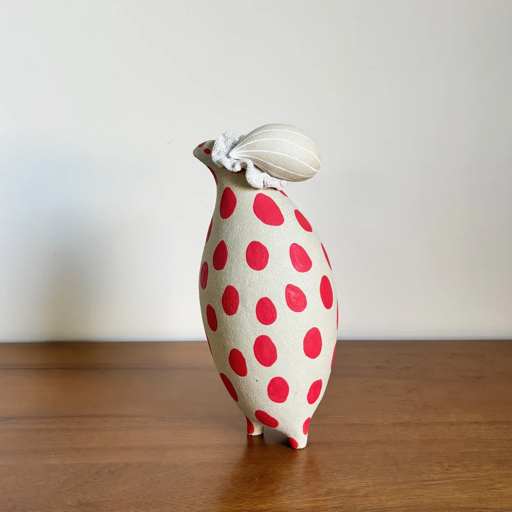 Emma Graham,   The Nurturing, Stoneware clay, underglaze, cotton thread, 10" x 4.7" 