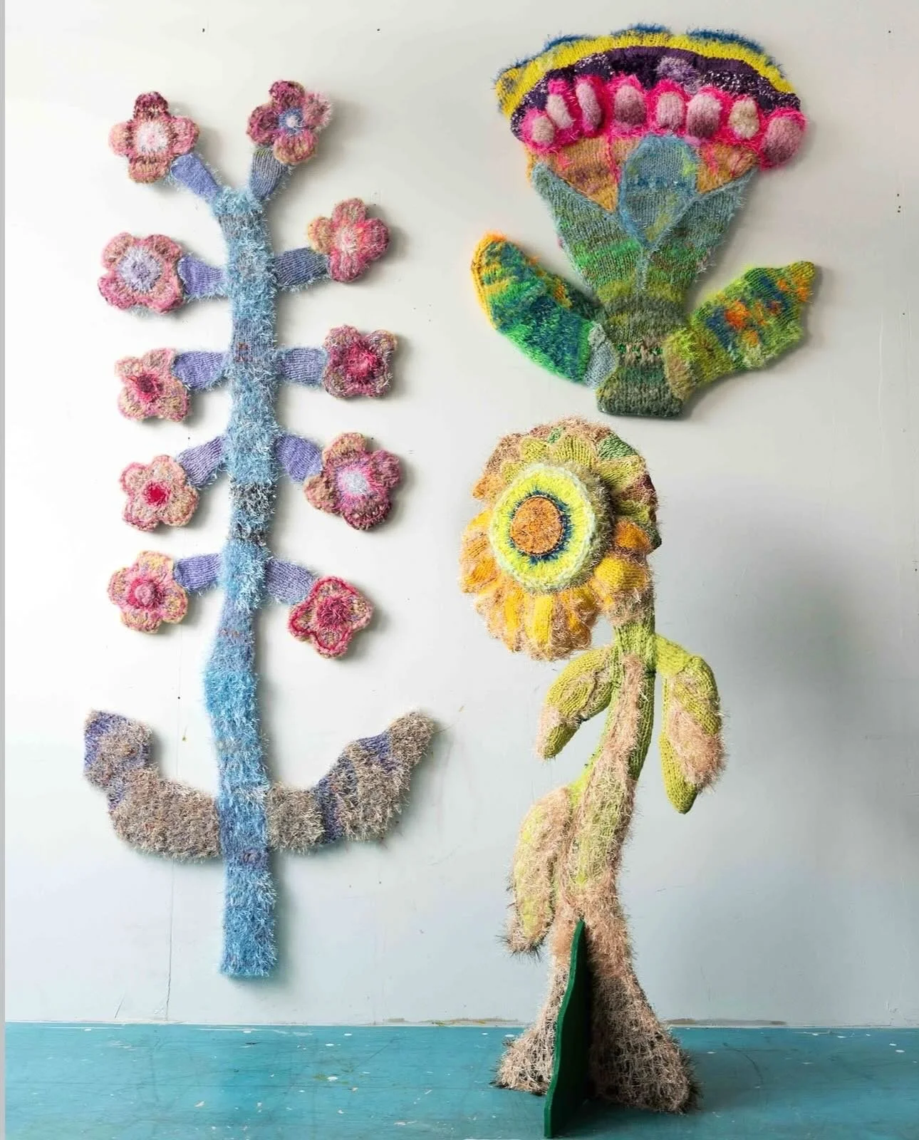 Emma Hasselblad is a Stockholm-based textile artist known for her vibrant, sculptural knitted works that blur the line between art, craft, and design. Inspired by nature, the body, and traditional textile techniques, her colorful creations transform 