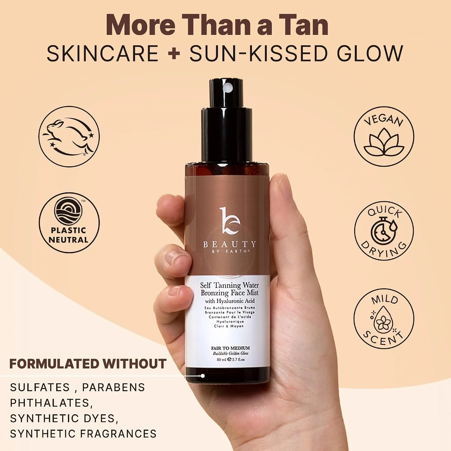 A person holding a bottle of Beauty by Earth self-tanning water bronzing face mist with hyaluronic acid, surrounded by icons indicating vegan, plastic neutral, quick drying, mild scent, and formulated without sulfates, parabens, phthalates, synthetic dyes, and synthetic fragrances.