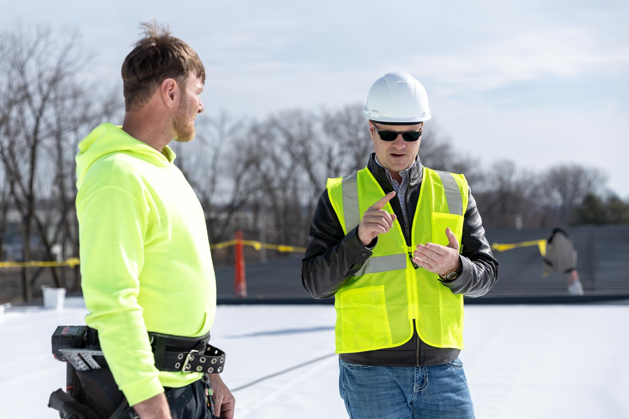 Joas, Owner of American Builders Commercial Roofing, inspecting a commercial roof in Northern Indiana