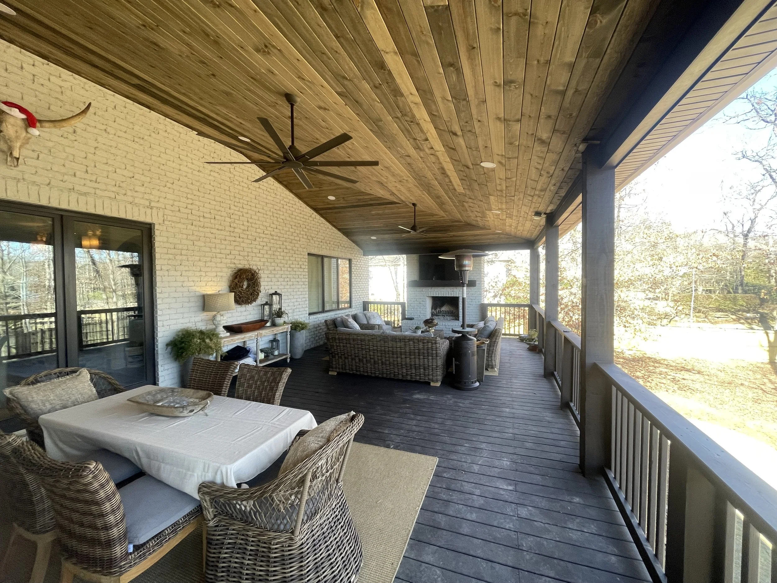 Covered deck with tongue-and-groove ceiling and outdoor living area built by Old Number One Customs in Auburn, AL