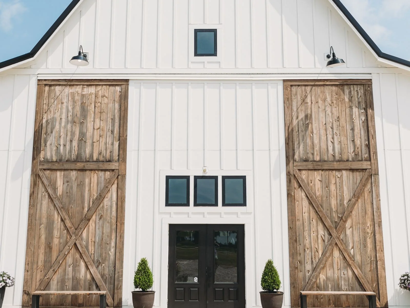 Example party barn with gambrel roof and wood barn doors