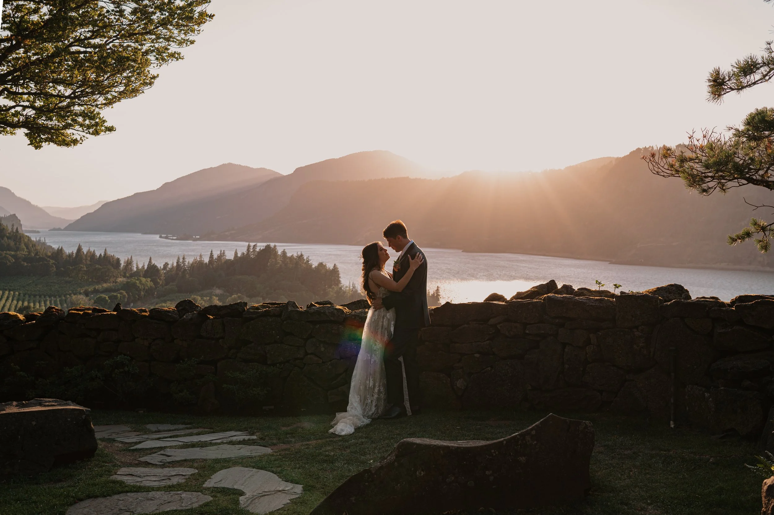 Bride and groom golden hour wedding portrait with sweeping views of the Columbia River Gorge.