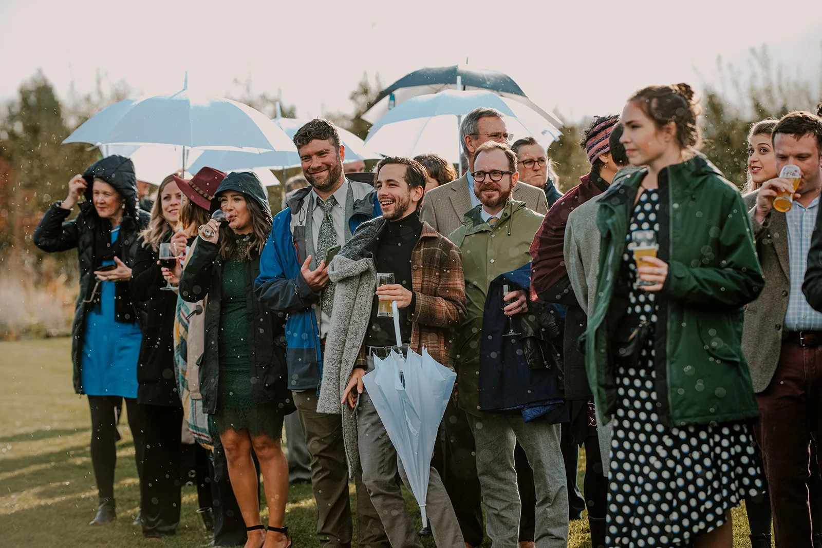 Wedding guests at a rainy outdoor wedding ceremony in the Columbia River Gorge photographed by Jen Jones Weddings.