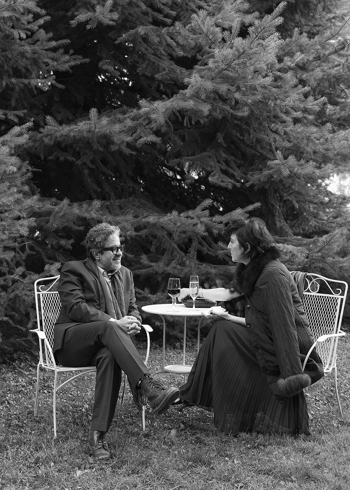 Wedding guests enjoying quiet conversation during cocktail hour at outdoor wedding in the Columbia River Gorge.