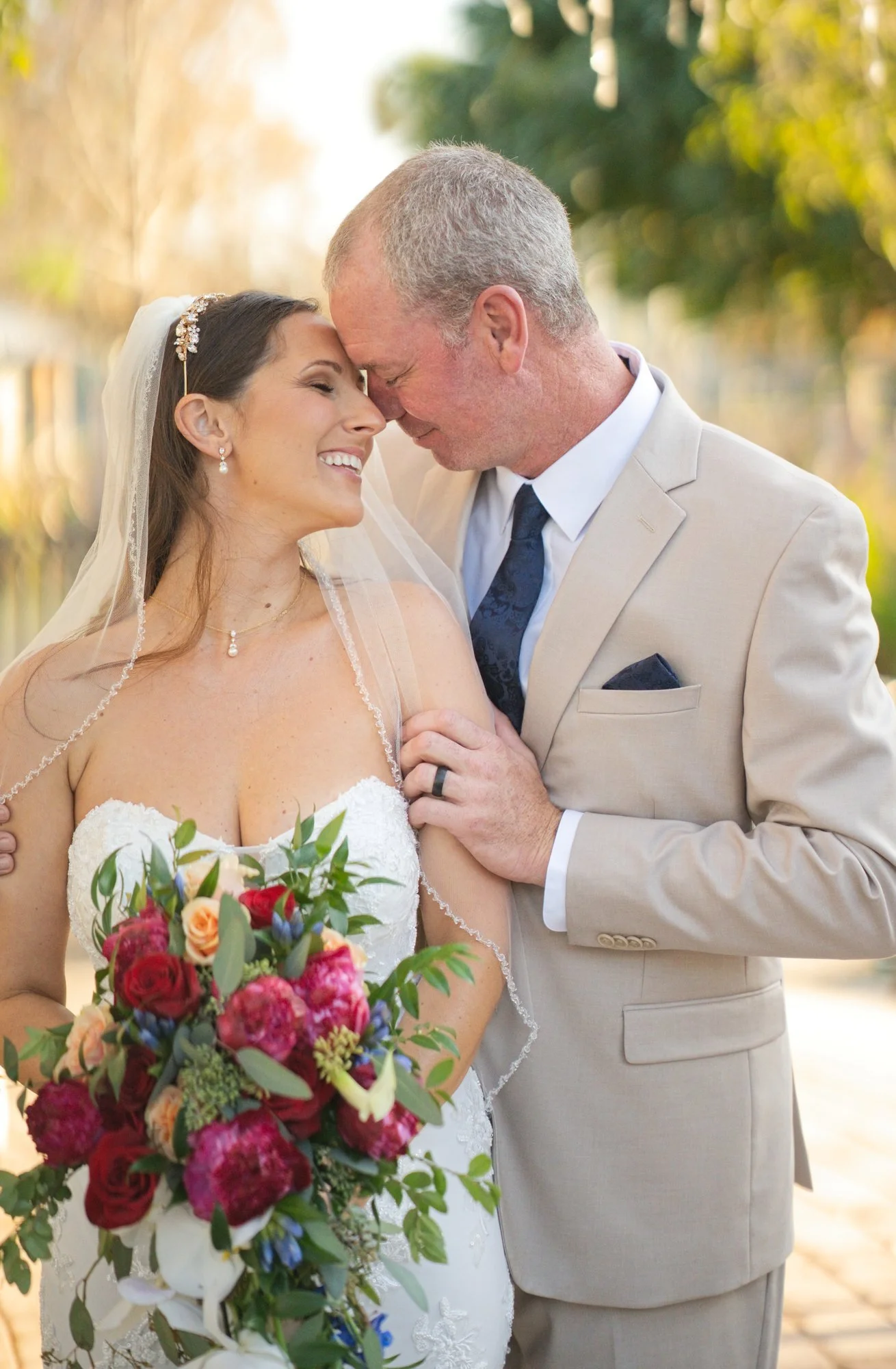 Close-up of a bride smiling as her husband holds her, Stuart courthouse wedding