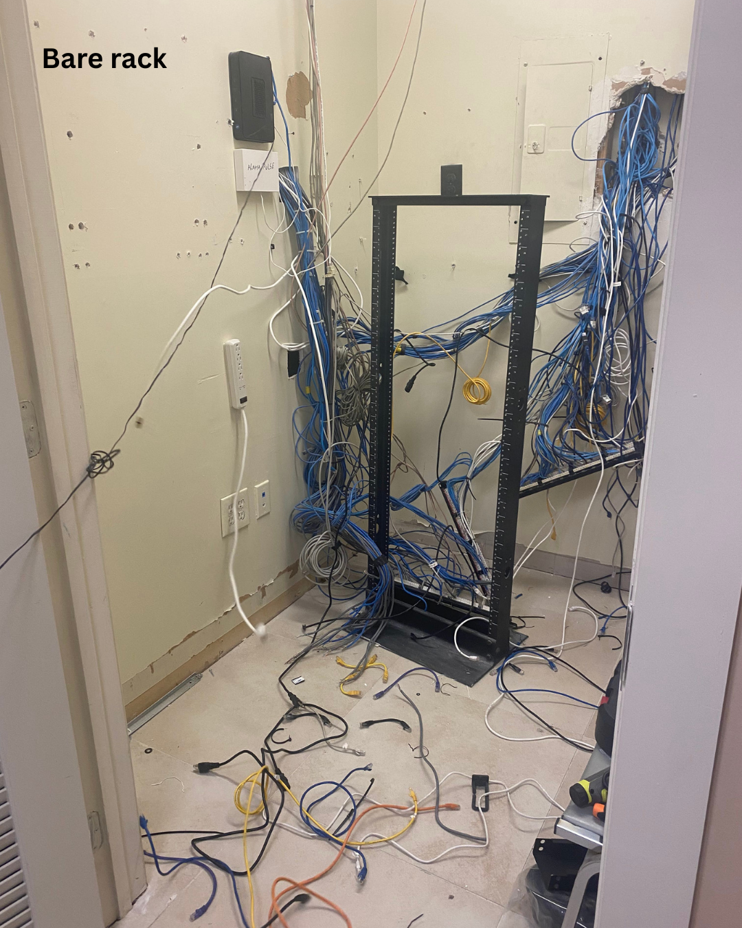 Empty rack – Equipment removed and all cabling loosened.