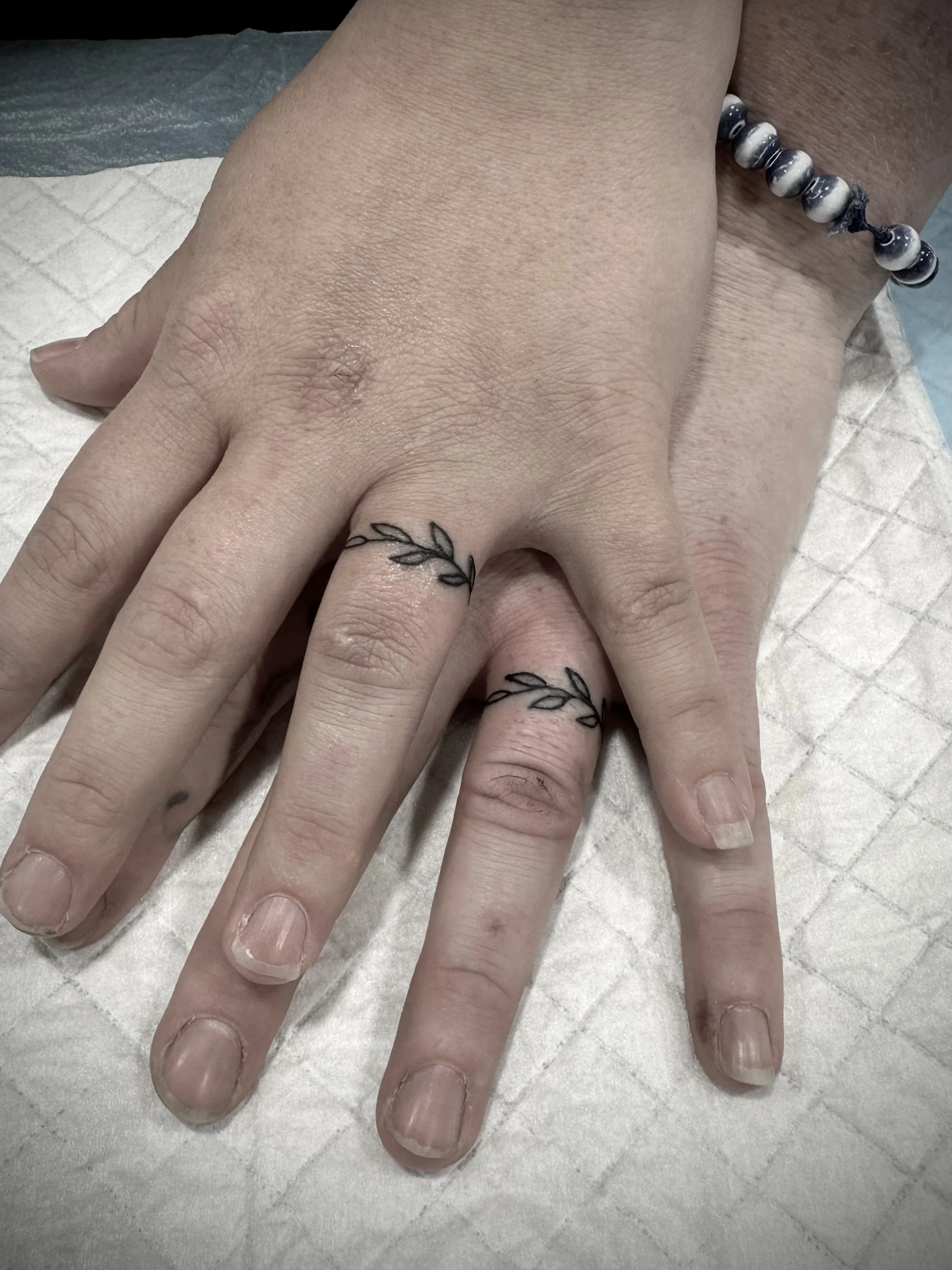 Matching ring finger tattoo brisbane best fine line artist