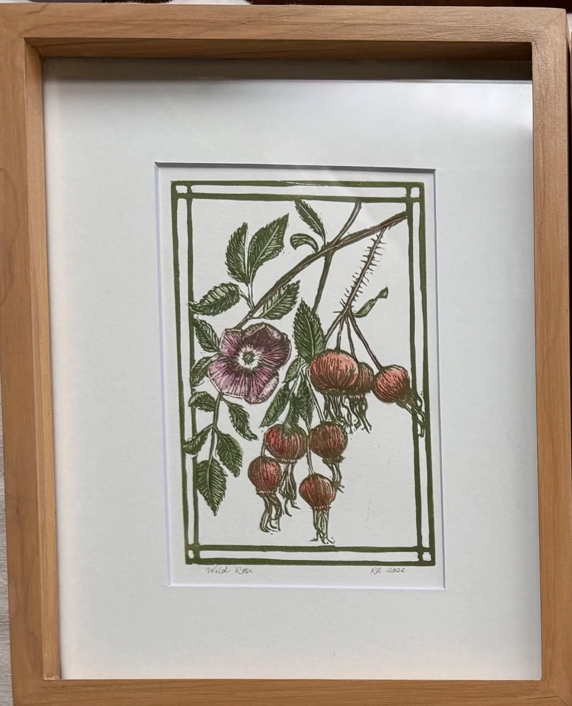 A hand-painted print matted and framed in a hand-made frame