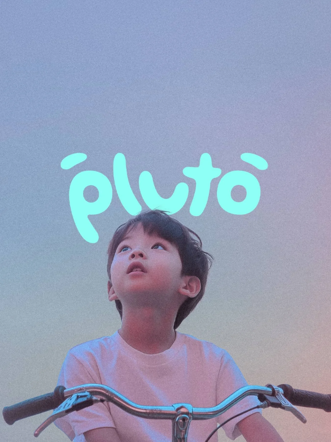 Boy sitting on a bike with the logo "Pluto" floating above his head