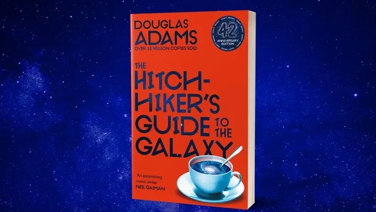 Book titled 'The Hitchhiker's Guide to the Galaxy' by Douglas Adams on a space-themed background.