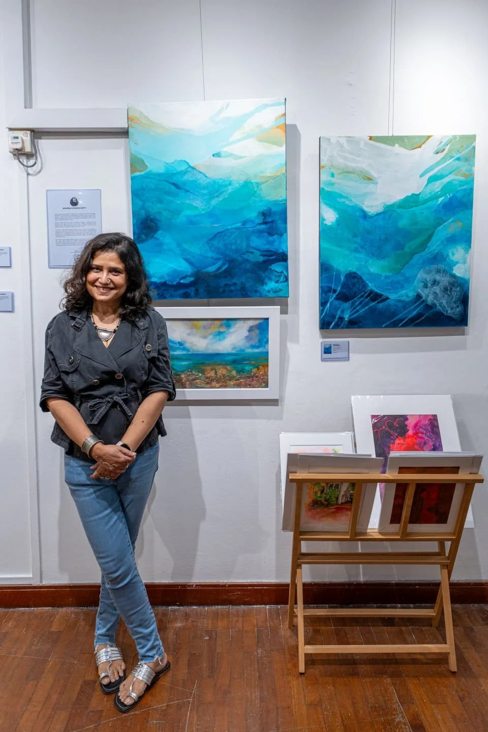 Canvas Connections artist Aparna Chakravarty with her artworks