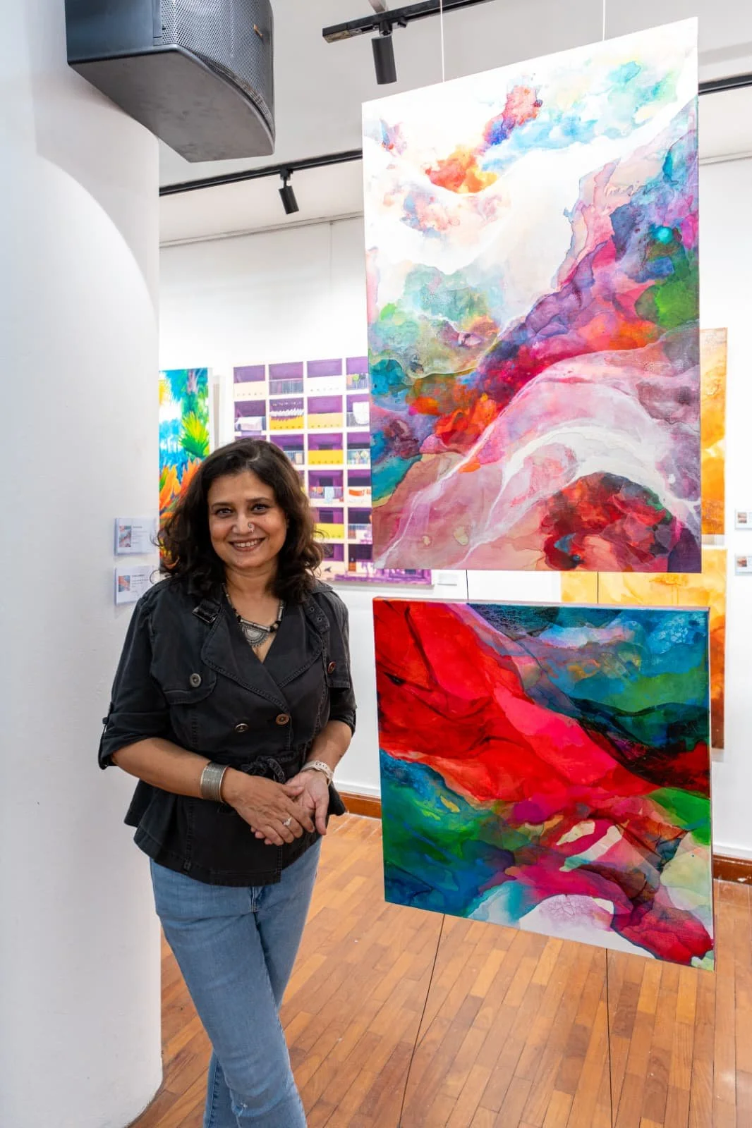 Canvas Connections artist Aparna Chakravarty with her artworks