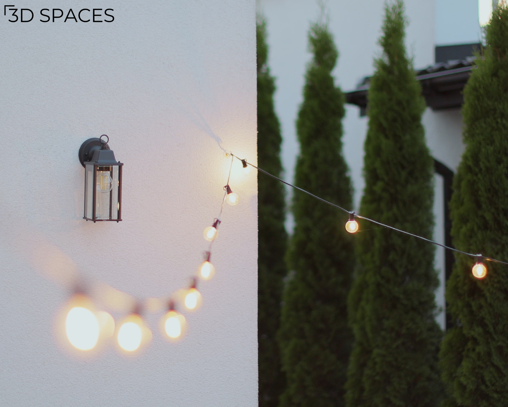 Modern outdoor lighting featuring string lights and a wall-mounted lantern to create a cozy backyard patio atmosphere.