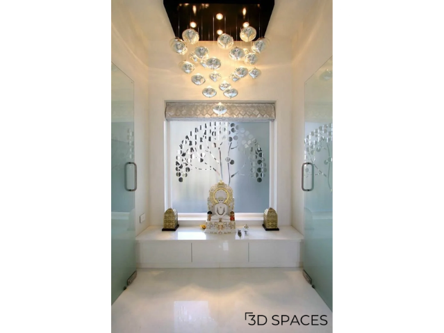 A simple marble altar placed in a modern home for a minimalist pooja setup.