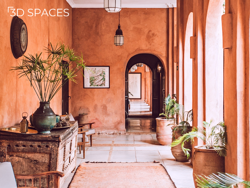 Traditional Indian home interior with terracotta walls, arched hallway, wooden antique furniture, indoor plants, and earthy rustic design.