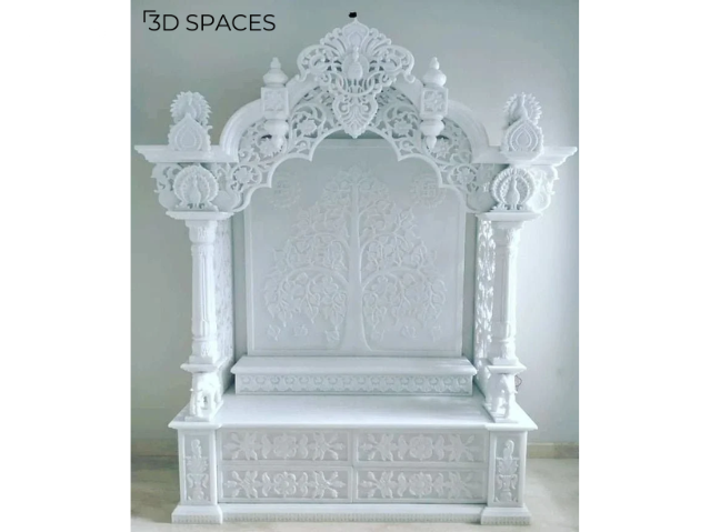 A luxurious pooja room design crafted entirely with marble, including walls, flooring, and altar.