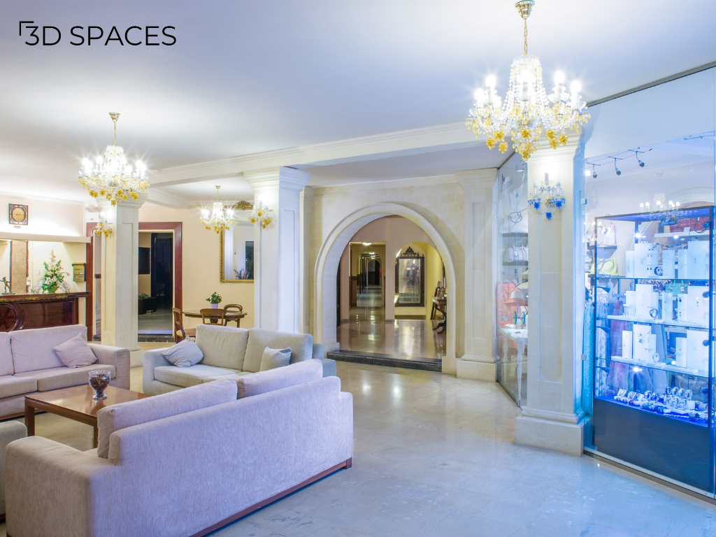 Luxury living room interior design with crystal chandeliers, marble flooring, elegant archways, and classic home décor.