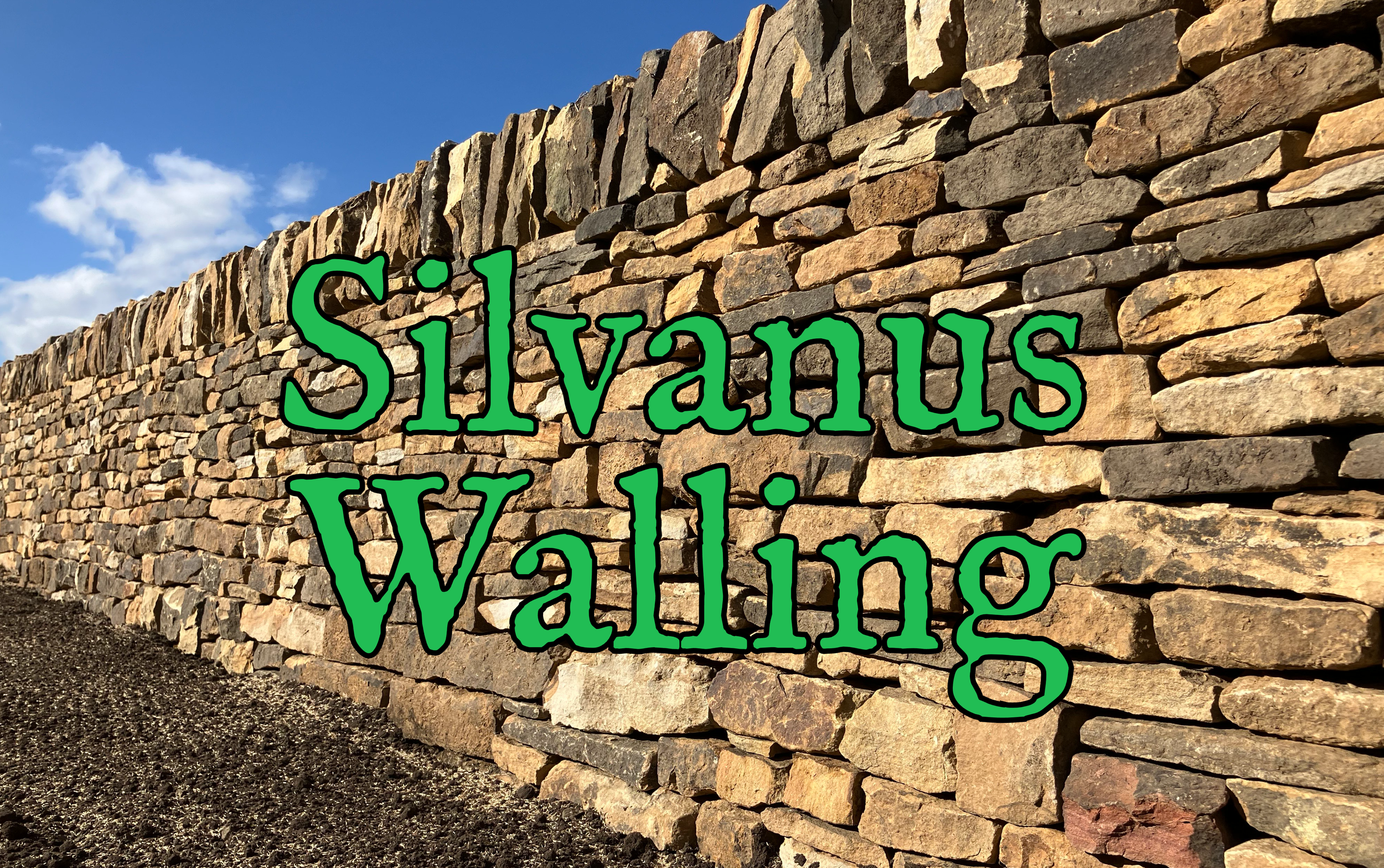 A stone wall with the words 'Silvanus Walling' written in large green and black text over the stones.