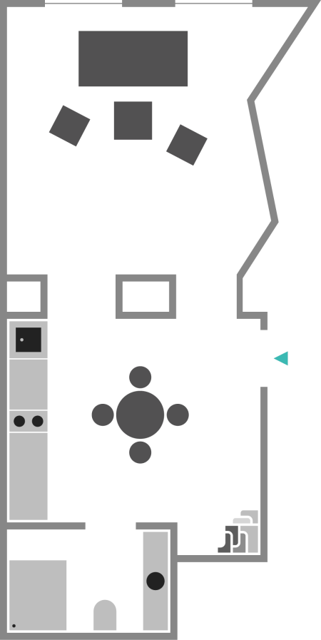 Floor plan layout of a small residence with designated rooms, furniture, and appliances.