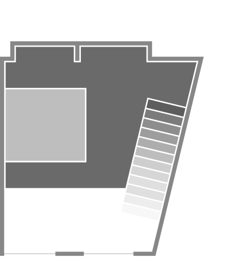 Floor plan showing a room with an open space and a staircase on the right side.
