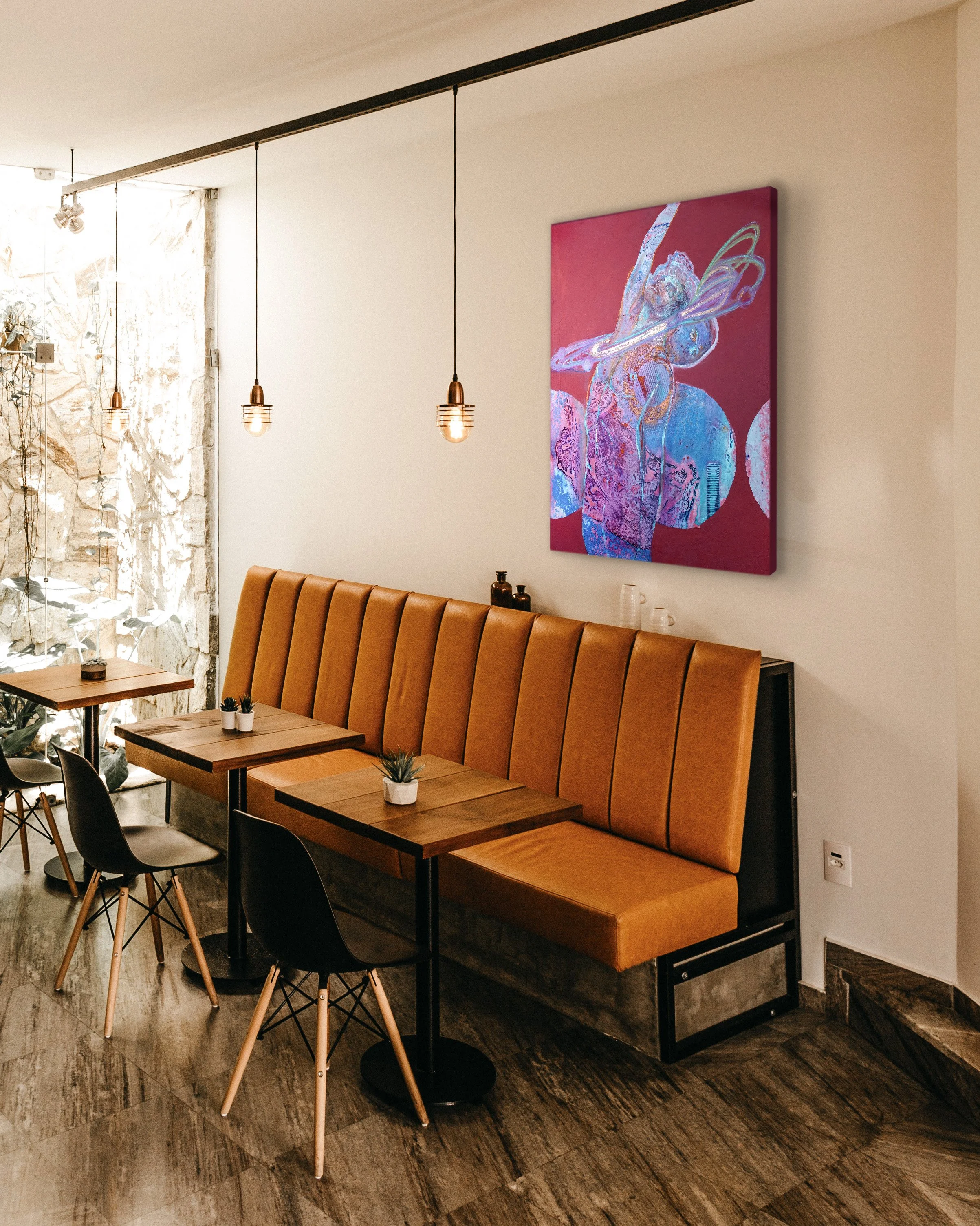 cafe-interior-with-orange-sofa-three-tables-three-black-chairs.jpg