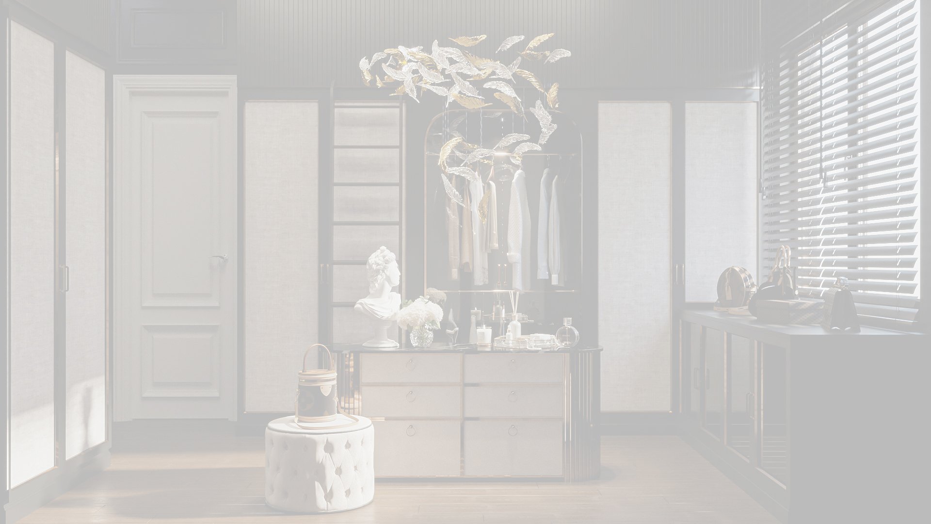 A walk-in closet with white walls, a white dresser, and a chandelier shaped like fish hanging from the ceiling. There are clothes hanging on a rack, and various accessories and decor items on the dresser and nearby surfaces.