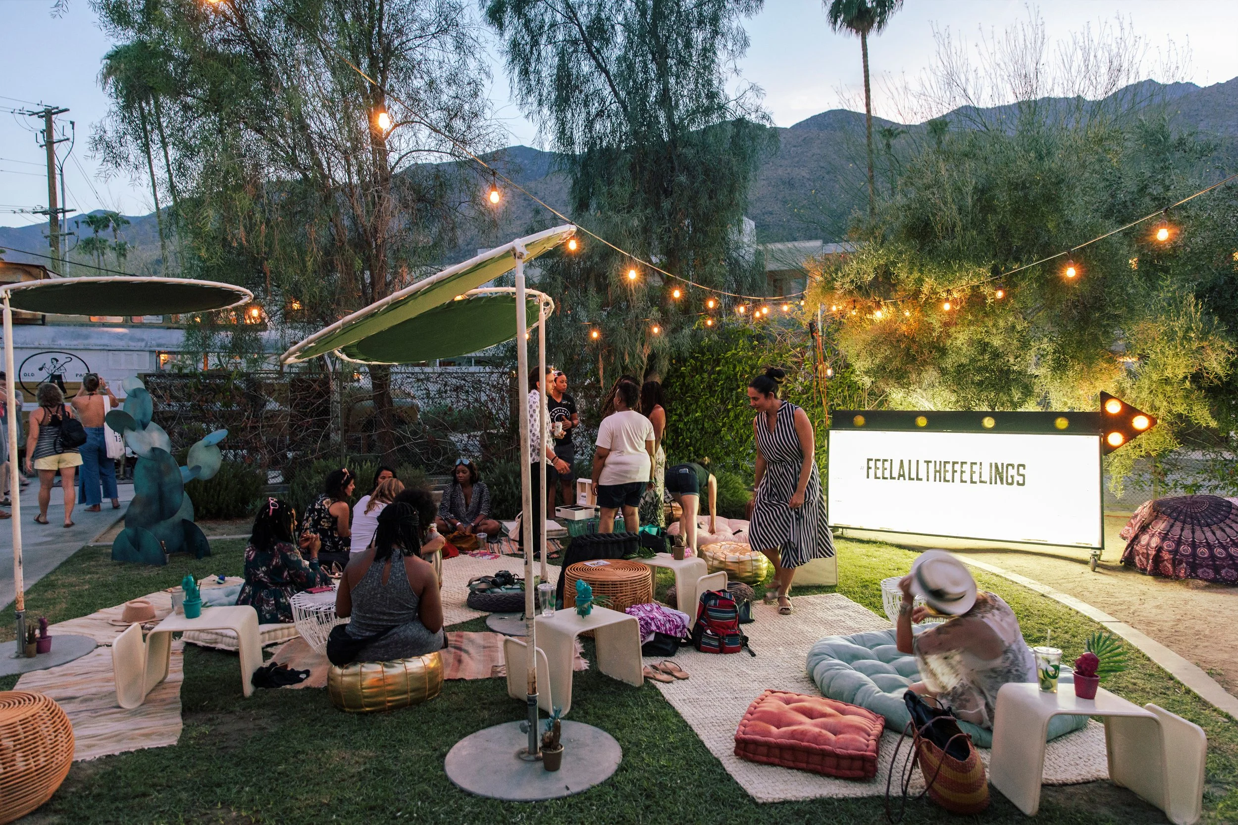 Outdoor lounge area with string lights and seating where guests gathered during the San Pellegrino SXSW activation