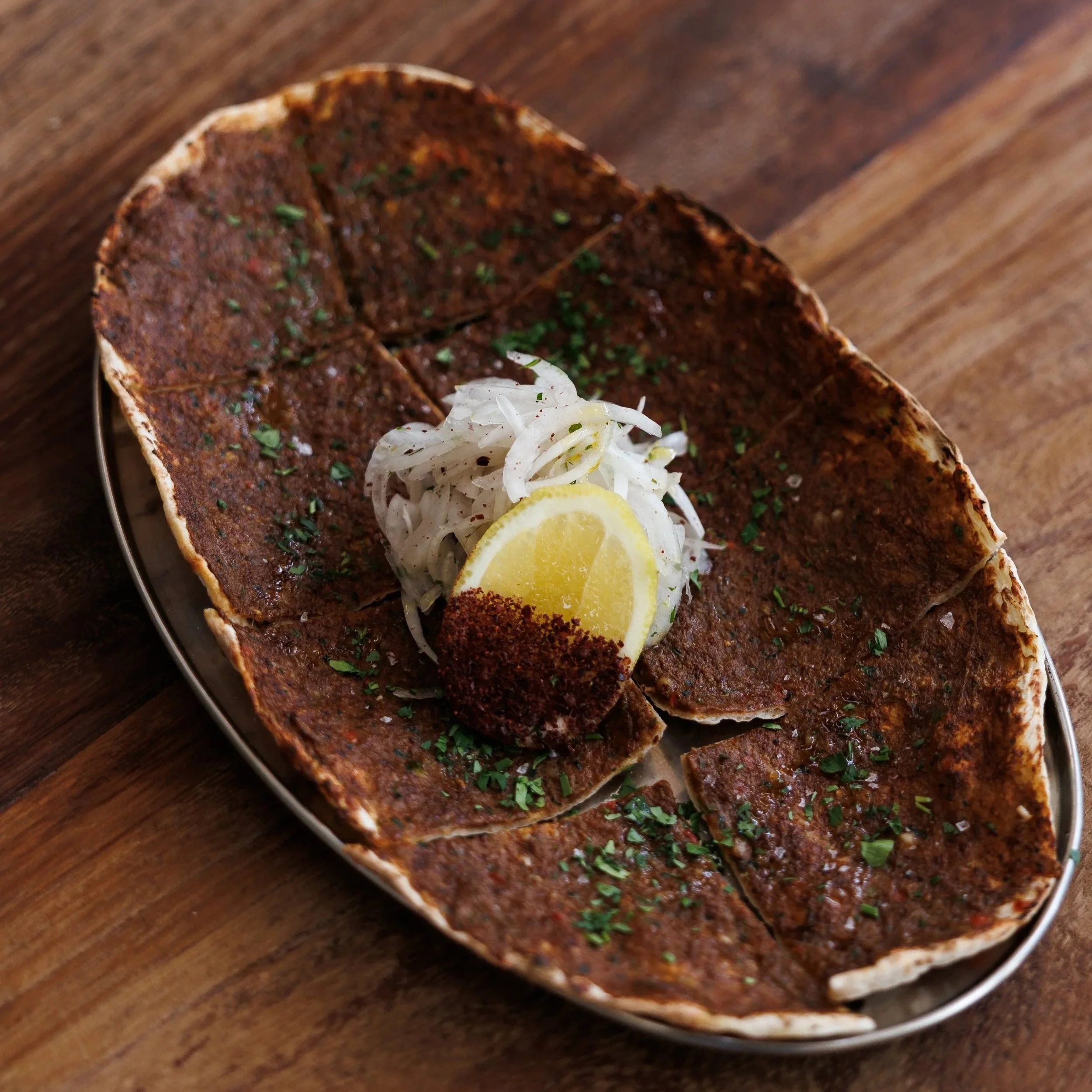  Nan-e Goost / spiced lamb, tomato & herb flatbread / 42 AED