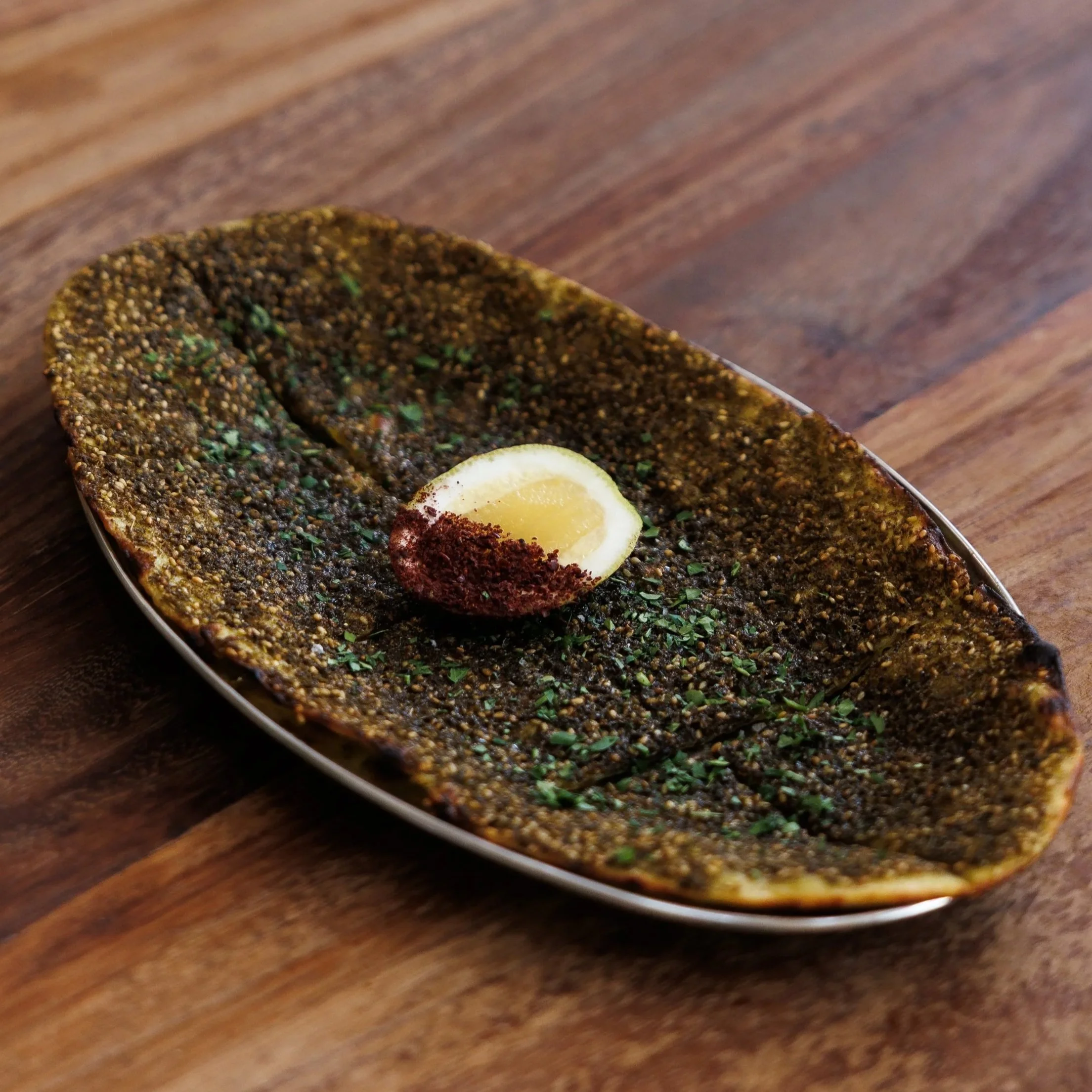 Nan-e Za’atar / wild herb & sesame sourdough flatbread / 36 AED
