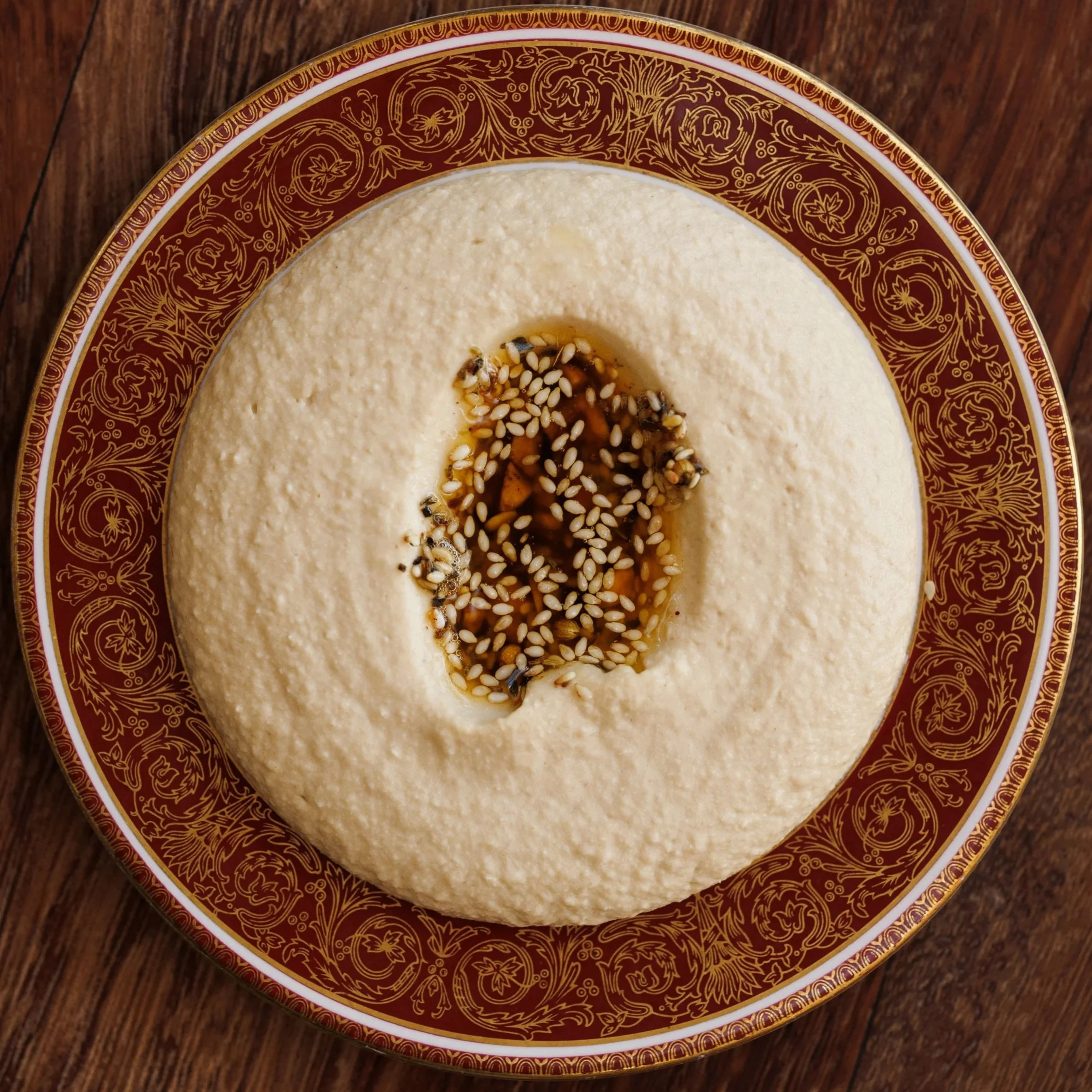 Hummus / tahini, lemon, pine nut, warm brown butter / 36 AED