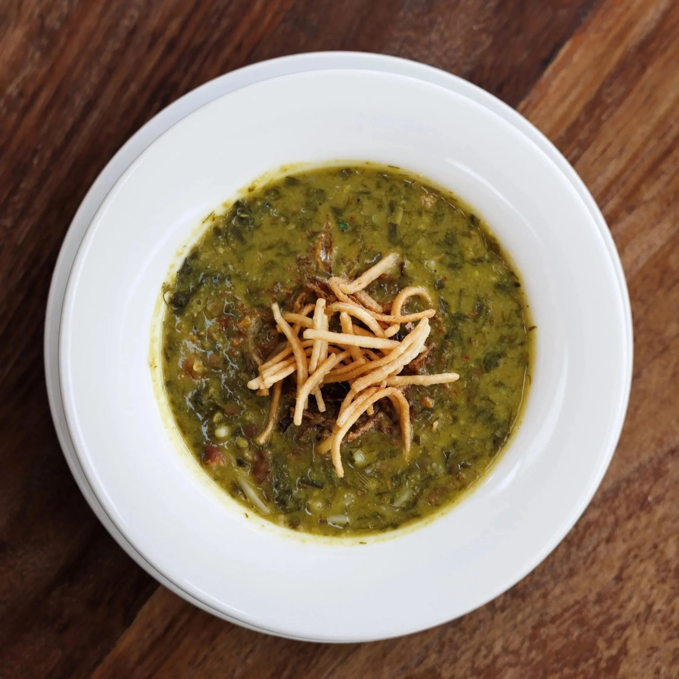 Ash-e Soup / chicken & herb broth, chickpeas, white beans, reshteh noodles, kashk / 39 AED