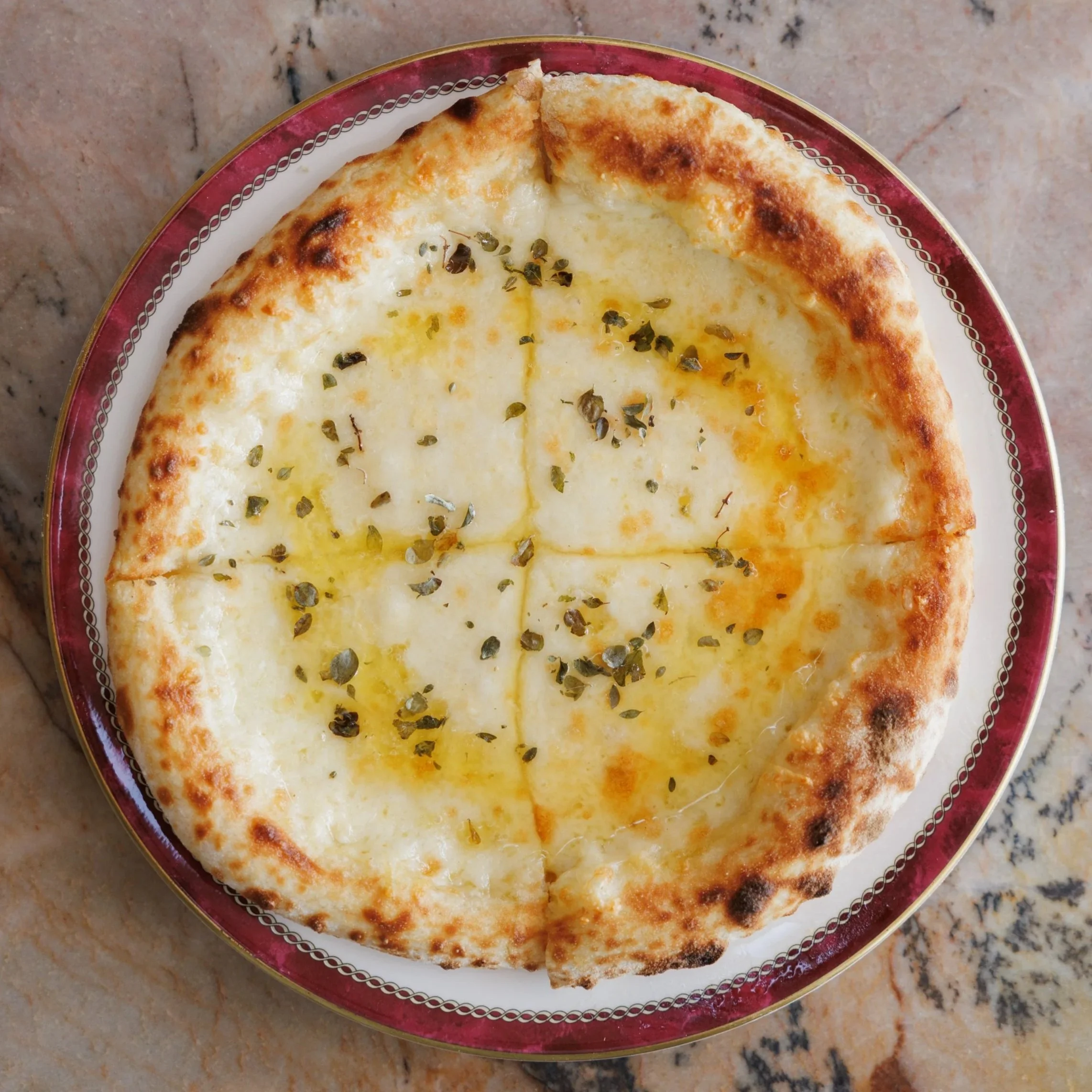 6 Cheese Flatbread / extra cheesy wood-fired bread / 26 AED