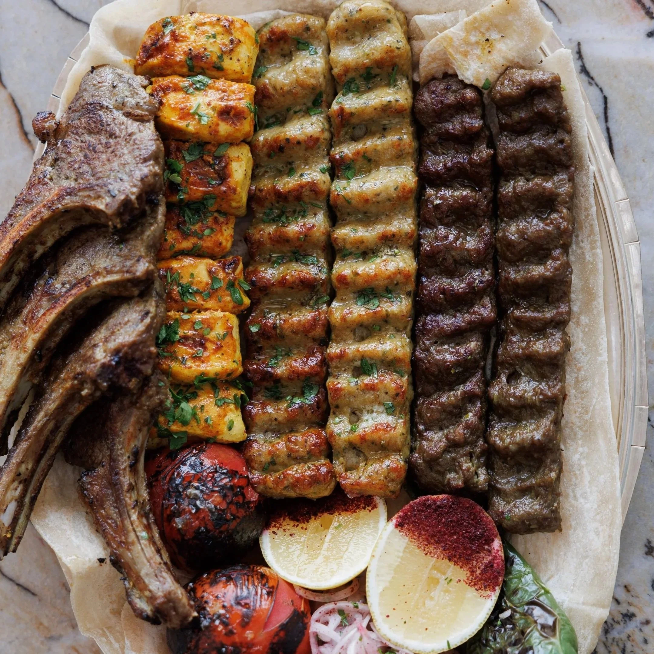Mixed Grill Platter / lamb & chicken koobideh, lamb chops, chicken joujeh, house rice, herb rice & homemade sauces / 395 AED